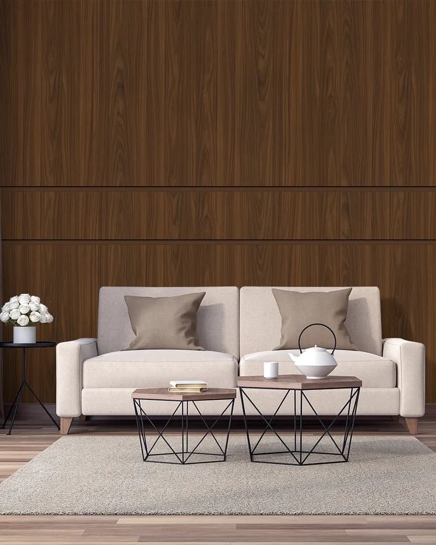Lounge with tall walnut laminate wall panels behind a cream sofa